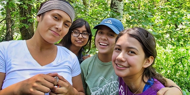 Four girls taking a moment to take a picture while on their fellowship.