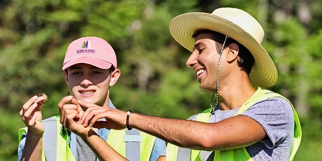 Two Ignite fellows examining their finds at Acadia National Park.