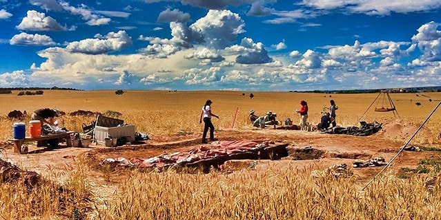 A groups of girls on an archeological dig site in Colorado.