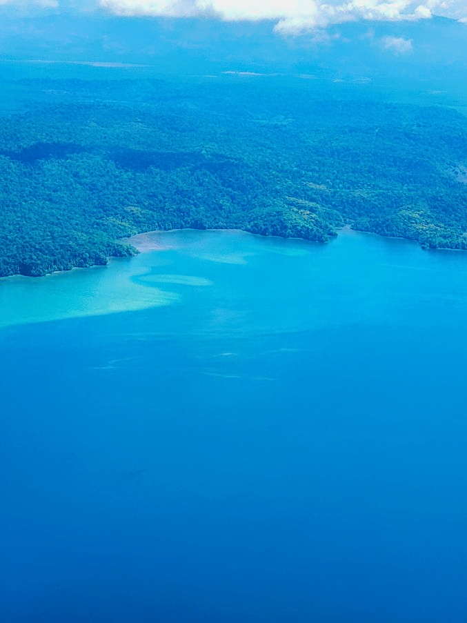 Aerial view of blue ocean and coastline of Costa Rica from a plane